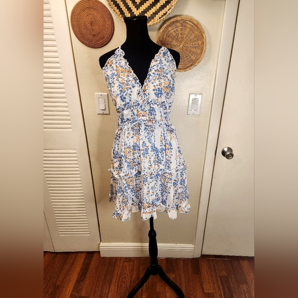 LAST ONE! Blue And White Floral Mini Dress With Ruffles And Criss-Cross Back - Picture 7 of 11